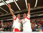 28 September 2003; Tyrone players Kevin Hughes and Brian McGuigan, right, celebrate after victory over Armagh. Bank of Ireland All-Ireland Senior Football Championship Final, Armagh v Tyrone, Croke Park, Dublin. Picture credit; Brendan Moran / SPORTSFILE