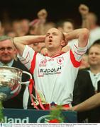 28 September 2003; Tyrone captain Peter Canavan celebrataes as he prepares to lift the Sam Maguire cup. Bank of Ireland All-Ireland Senior Football Championship Final, Armagh v Tyrone, Croke Park, Dublin. Picture credit; Brendan Moran / SPORTSFILE