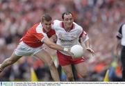 28 September 2003; Brian Dooher, Tyrone, in action against Armagh's Philip Loughran. Bank of Ireland All-Ireland Senior Football Championship Final, Armagh v Tyrone, Croke Park, Dublin. Picture credit; David Maher / SPORTSFILE *EDI*