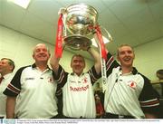 28 September 2003; Tyrone manager Mickey Harte holds the Sam Mguire cup aloft with Fr. Gerard McAleer, left, and Paddy Taller, right. Bank of Ireland All-Ireland Senior Football Championship Final, Armagh v Tyrone, Croke Park, Dublin. Picture credit; Brendan Moran / SPORTSFILE