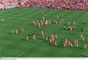 28 September 2003; Players from Tyrone and Armagh run towards the Hill 16 end of the ground. Bank of Ireland All-Ireland Senior Football Championship Final, Armagh v Tyrone, Croke Park, Dublin. Picture credit; Brendan Moran / SPORTSFILE