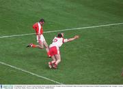 28 September 2003; Tyrone's Conor Gormley blocks a late shot from Armagh's Steven McDonnell. Bank of Ireland All-Ireland Senior Football Championship Final, Armagh v Tyrone, Croke Park, Dublin. Picture credit; Ray McManus / SPORTSFILE