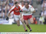 28 September 2003; Brian Dooher, Tyrone, in action against Armagh's Kieran Hughes. Bank of Ireland All-Ireland Senior Football Championship Final, Armagh v Tyrone, Croke Park, Dublin. Picture credit; Pat Murphy / SPORTSFILE *EDI*