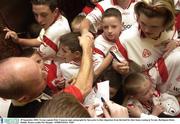 29 September 2003; Tyrone captain Peter Canavan signs autographs for fans prior to their departure from the hotel for their home coming in Tyrone. Burlington Hotel, Dublin. Picture credit; Pat Murphy / SPORTSFILE *EDI*