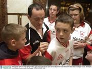 29 September 2003; Tyrone's Brian Dooher signs autographs for fans prior to their departure from the hotel for their home coming in Tyrone. Burlington Hotel, Dublin. Picture credit; Pat Murphy / SPORTSFILE *EDI*