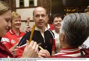 29 September 2003; Tyrone captain Peter Canavan signs autographs for fans prior to their departure from the hotel for their home coming in Tyrone. Burlington Hotel, Dublin. Picture credit; Pat Murphy / SPORTSFILE *EDI*