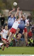 4 October 2003; Kelvin Hughes, Tyrone, goes up for a ball with Dublin's Conal Keaney and Declan O'Mahony. All-Ireland U21 Football Championship Final, Dublin v Tyrone, Pairc Tailteann, Navan, Co. Meath. Picture credit; Matt Browne / SPORTSFILE *EDI*