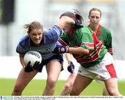 5 October 2003; Martina Farrell, Dublin captain, is tackled by Mayo's Michelle McGing. TG4 Ladies All-Ireland Senior Football Championship Final, Mayo v Dublin, Croke Park, Dublin. Picture credit; Matt Browne / SPORTSFILE *EDI*