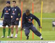 8 October 2003; Clinton Morrison, Republic of Ireland, in action as team-mates Graham Kavanagh, left, and Ian Harte, right, watch on during squad training. Malahide Football Club, Malahide, Co. Dublin. Soccer. Picture credit; David Maher / SPORTSFILE *EDI*