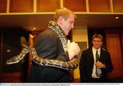 9 October 2003; Ireland lock Paul O'Connell, watched by Ronan O'Gara, handles a snake at a Welcome Reception held by the Gosford City Council where the players were presented with their 2003 Rugby World Cup caps. 2003 Rugby World Cup, Welcome Reception, Crowne Plaza Hotel, Terrigal, New South Wales, Australia. Picture credit; Brendan Moran / SPORTSFILE *EDI*