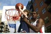 9 October 2003; Notre Dame's Bruce Jolly with 3 year old Laura Roantree at the launch of the ESB Super League season and of Basketball Ireland. Clarion Hotel, Dublin. Picture credit; Ray McManus / SPORTSFILE *EDI*