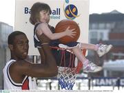 9 October 2003; Notre Dame's Bruce Jolly slam dunks 3 year old Laura Roantree at the launch of the ESB Super League and Basketball Ireland. Clarion Hotel, Dublin. Picture credit; Pat Murphy / SPORTSFILE *EDI*