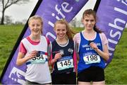15 February 2019; Orna Moynihan, centre, from Colasiste Muire, Ennis, who won the Junior Girls 2500m, from second place Alex Cashman, left, from Pobaiscoll na Trionoide, Youghal, Co Cork and third place Neasa Ni Ainfein, right, from Ennis during the Irish Life Health Munster Schools Cross Country event at WIT Sports Campus in Carrignore, Waterford. Photo by Matt Browne/Sportsfile