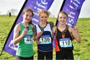 15 February 2019; Louise O'Mahony, centre, from Colaiste Muire, Ennis, who won the Minor Girls 2000m from second place Nicole Dinan,left, from St Angela's Cork and third place Ave Fitzgerald, right, from Colaiste An Chroi Naofa, Cork during the Irish Life Health Munster Schools Cross Country event at WIT Sports Campus in Carrignore, Waterford. Photo by Matt Browne/Sportsfile