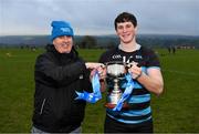 15 February 2019; Gerry Tully, Chairman of Comhairle Ardoideachais CLG, presents the cup to SRC captain Dylan McKenna following the Electric Ireland HE GAA Corn Comhairle Ardoideachais Final match between Southern Regional College and Mary I Thurles at Mallow GAA in Cork. Follow and be a part of the conversation around the Electric Ireland Higher Education Championships on social media using the hashtag #FirstClassRivals and follow @ElectricIreland for updates, streaming, match commentary and highlights. Photo by Diarmuid Greene/Sportsfile