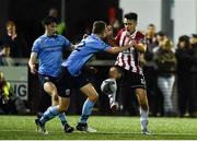 15 February 2019; Josh Kerr of Derry City in action against Mark Dignam and Neil Farrugia of UCD during the SSE Airtricity League Premier Division match between Derry City and UCD at the Ryan McBride Brandywell Stadium in Derry. Photo by Oliver McVeigh/Sportsfile