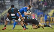16 February 2019; Ross Byrne of Leinster is tackled by Maxime Mbandà, left, and Giovanni Licata of Zebre during the Guinness PRO14 Round 15 match between Zebre and Leinster at the Luigi Zaffanella Stadium in Viadana, Italy. Photo by Ramsey Cardy/Sportsfile