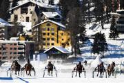 17 February 2019; Runners and riders race towards the finish line during the Preis der GammaCatering AG trotting race at the White Turf horse racing event at St Moritz, Switzerland. Photo by Ramsey Cardy/Sportsfile