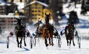 17 February 2019; Vigo du Verger and rider Jean-Bernard Matthey, centre, after winning the Preis der GammaCatering AG trotting race at the White Turf horse racing event at St Moritz, Switzerland. Photo by Ramsey Cardy/Sportsfile