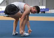 17 February 2019; Matthew Behan of Crusaders AC, Co. Dublin, pointing at his custom spikes after winning the Men's 60m hurdles during day two of the Irish Life Health National Senior Indoor Athletics Championships at the National Indoor Arena in Abbotstown, Dublin. Photo by Eóin Noonan/Sportsfile