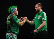 21 February 2019; Peter Wright, left, and Steve Lennon shake hands following their Premier League Darts Night Three match at the 3Arena in Dublin Photo by Seb Daly/Sportsfile