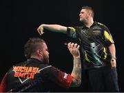21 February 2019; (EDITORS NOTE: Image created using the multiple exposure function in camera) Michael Smith, left, and Daryl Gurney during their Premier League Darts Night Three match at the 3Arena in Dublin Photo by Seb Daly/Sportsfile