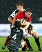 22 February 2019; JJ Hanrahan of Munster is tackled by James King(4) and Olly Cracknell of Ospreys during the Guinness PRO14 Round 16 match between Ospreys and Munster at Liberty Stadium in Swansea, Wales. Photo by Darren Griffiths/Sportsfile