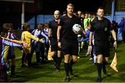 22 February 2019; Referee Ben Connolly, centre, with assistant referees David Berry, left, and Oliver Moran leads the teams out prior to the SSE Airtricity League First Division match between Drogheda United and Cobh Ramblers in United Park in Drogheda, Co. Louth. Photo by Ben McShane/Sportsfile