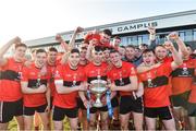 23 February 2019; University College Cork joint captains Eoghan Murphy, 6, David Lowney, 2, and Conor Browne, 8, lift the Fitzgibbon Cup as their team-mates celebrate after the Electric Ireland HE GAA Fitzgibbon Cup Final match between Mary Immaculate College and University College Cork at Waterford IT in Waterford. Photo by Matt Browne/Sportsfile