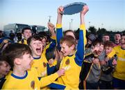 23 February 2019; South Tipperary captain Tom Delaney lifts the plate and celebrates with team-mates following the U13 SFAI SUBWAY Plate National Final match between Midlands SL and South Tipperary at Mullingar Athletic FC in Gainestown, Mullingar, Co. Westmeath. Photo by David Fitzgerald/Sportsfile