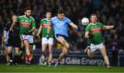 23 February 2019; Con O’Callaghan of Dublin, under pressure from Mayo players Kevin McLoughlin, left, and Colm Boyle, kicks his side's 8th point in the 48th minute during the Allianz Football League Division 1 Round 4 match between Dublin and Mayo at Croke Park in Dublin. Photo by Ray McManus/Sportsfile