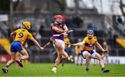 24 February 2019; Lee Chin of Wexford is hooked by Colm Galvin of Clare during the Allianz Hurling League Division 1A Round 4 match between Clare and Wexford at Cusack Park in Ennis, Clare. Photo by Eóin Noonan/Sportsfile