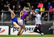 24 February 2019; Wexford goalkeeper Mark Fanning is protected from the oncoming challenge from John Conlon of Clare by team mate Darren Byrne during the Allianz Hurling League Division 1A Round 4 match between Clare and Wexford at Cusack Park in Ennis, Clare. Photo by Eóin Noonan/Sportsfile