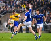 24 February 2019; Cathal Cregg of Roscommon kicks a point under pressure from Dara McVeety of Cavan during the Allianz Football League Division 1 Round 4 match between Cavan and Roscommon at the Kingspan Breffni Park in Cavan. Photo by Seb Daly/Sportsfile