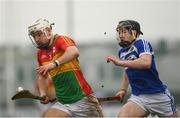 24 February 2019; Chris Nolan of Carlow in action against Donnacha Hartnett of Laois during the Allianz Hurling League Division 1B Round 4 match between Carlow and Laois at Netwatch Cullen Park in Carlow. Photo by Harry Murphy/Sportsfile