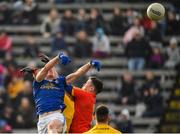 24 February 2019; Martin Reilly of Cavan out-jumps Darren O’Malley of Roscommon to score his side's third goal of the game during the Allianz Football League Division 1 Round 4 match between Cavan and Roscommon at the Kingspan Breffni Park in Cavan. Photo by Seb Daly/Sportsfile