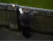 24 February 2019; A supporter checks his programme during the Allianz Hurling League Division 1B Round 4 match between Dublin and Waterford at Parnell Park in Donnycarney, Dublin. Photo by Daire Brennan/Sportsfile