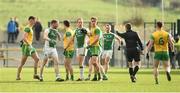 24 February 2019; Referee Padraig Hughes pointing to the four players he is to show yellow cards to following a dispute before the start of the second half during the Allianz Football League Division 2 Round 4 match between Donegal and Fermanagh at O'Donnell Park in Letterkenny, Co Donegal. Photo by Oliver McVeigh/Sportsfile