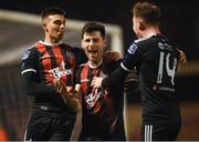 25 February 2019; Dinny Corcoran celebrates after scoring his side's first goal with his Bohemians team-mates Daniel Mandroiu, left, and Conor Levingston, right, during the SSE Airtricity League Premier Division match between Bohemians and Shamrock Rovers at Dalymount Park in Dublin. Photo by Stephen McCarthy/Sportsfile