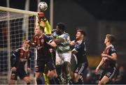 25 February 2019; James Talbot of Bohemians punches the ball clear ahead of Daniel Carr of Shamrock Rovers, centre, Derek Pender, left, and Aaron Barry of Bohemians during the SSE Airtricity League Premier Division match between Bohemians and Shamrock Rovers at Dalymount Park in Dublin. Photo by Ben McShane/Sportsfile