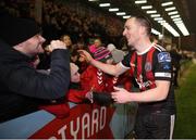 25 February 2019; Bohemians captain Derek Pender celebrates with Bohemians supporter Laurence Kinlan following the SSE Airtricity League Premier Division match between Bohemians and Shamrock Rovers at Dalymount Park in Dublin. Photo by Ben McShane/Sportsfile
