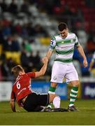 22 February 2019; Greg Sloggett of Derry City is helped up by Aaron Greene of Shamrock Rovers City during the SSE Airtricity League Premier Division match between Shamrock Rovers and Derry City at Tallaght Stadium in Dublin. Photo by Seb Daly/Sportsfile