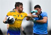 3 March 2019; Conor Devaney of Roscommon is tackled by Colm Basquel of Dublin during the Allianz Football League Division 1 Round 5 match between Roscommon and Dublin at Dr Hyde Park in Roscommon. Photo by Ramsey Cardy/Sportsfile