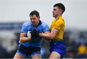 3 March 2019; Dean Rock of Dublin is tackled by Conor Daly of Roscommon during the Allianz Football League Division 1 Round 5 match between Roscommon and Dublin at Dr Hyde Park in Roscommon. Photo by Ramsey Cardy/Sportsfile