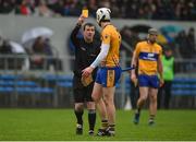 3 March 2019; Conor Cleary of Clare is shown a yellow card by Referee Paud O'Dwyer during the Allianz Hurling League Division 1A Round 5 match between Clare and Limerick at Cusack Park in Ennis, Co. Clare. Photo by Diarmuid Greene/Sportsfile