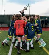 4 March 2019; Kate McClenaghan of Moville CC lifts the trophy with teammates following the FAI Schools Senior Girls National Cup Final match between Athlone Community College and Moville Community College at the Showgrounds in Sligo. Photo by Harry Murphy/Sportsfile