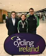 4 March 2019; Lydia Boylan with CEO Cycling Ireland John Foley, left, and Cycling Ireland High Performance Director Brian Nugent on her return home to Dublin Airport after winning a silver medal in the Points Race at the World Track Cycling Championships in Poland. Photo by Eóin Noonan/Sportsfile