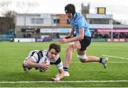6 March 2019; Dylan O’Grady of Belvedere College scores his side's second try despite the efforts of Stephen Woods of St Michael's College during the Bank of Ireland Schools Senior Cup semi-final match between Belvedere College and St Michael's College at Energia Park in Donnybrook, Dublin. Photo by Piaras Ó Mídheach/Sportsfile