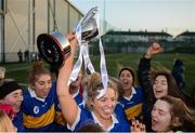 8 March 2019; Emma White of DKIT lifts the trophy following the Gourmet Food Parlour Moynihan Cup Final match between Dundalk Institute of Technology and Letterkenny Institute of Technology at TU Dublin Broombridge Sports Grounds in Dublin. Photo by Harry Murphy/Sportsfile