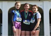 9 March 2019; Runners on the podium, from left, Leah Toher of Presentation College Headford, Co Galway, second place, Erin Leavy of St Vincent's Dundalk, Co Louth, first place, and Gara Williams of Castleknock CC, third place, after the Minors Girls event in the Irish Life Health All Ireland Schools Cross Country at Clongowes Wood College in Clane, Co Kildare. Photo by Piaras Ó Mídheach/Sportsfile